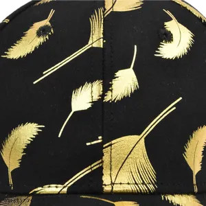 Black baseball cap with gold feather embroidery detail and high density twill fabric