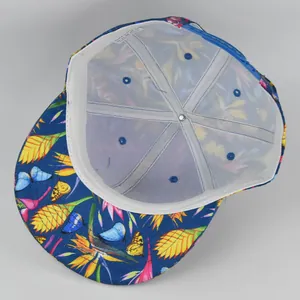 Detail view showing tropical butterfly print snapback hat with interior mesh support