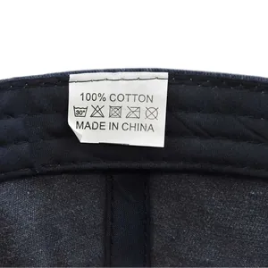 Detailed macro view of the 100 percent cotton care label on the American flag baseball cap