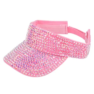 Detailed view of pink rhinestone sun visor with adjustable hook and loop closure