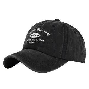 Close-up of vintage embroidery and washed fabric texture on the black baseball cap
