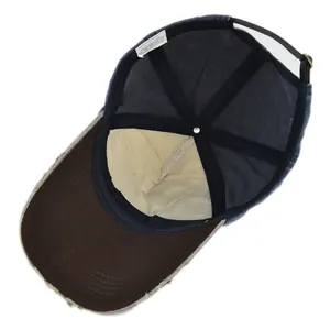 Detail view of the baseball cap's internal 100% cotton construction and navy sweatband