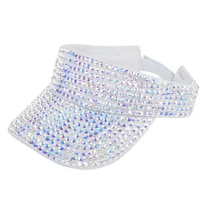 Detailed view of white sun visor with sparkling rhinestones and adjustable velcro strap