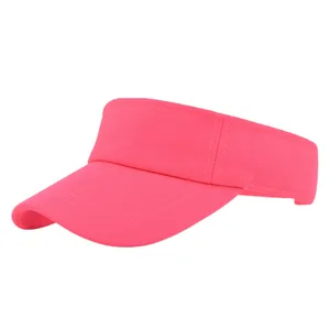 Detail of bright pink ponytail sun visor featuring breathable mesh fabric and fine stitching
