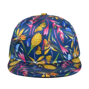 Navy blue snapback hat with tropical floral and butterfly embroidery in a 45-degree view