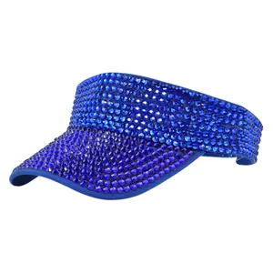 Detailed close-up of a navy blue visor hat featuring shimmering rhinestone embellishments