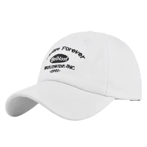 Detail of black Badblood embroidery on white cotton vintage baseball cap with worldwide text
