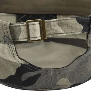 Detail of military cap back showing adjustable bronze metal buckle and camouflage canvas