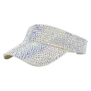 Close-up of sparkling iridescent rhinestones on cream-white sun visor hat brim