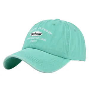 Close-up of mint green vintage baseball cap featuring premium embroidery and washed cotton