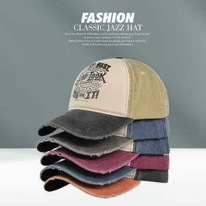 Close-up of stacked vintage washed baseball caps featuring distressed edges and retro prints