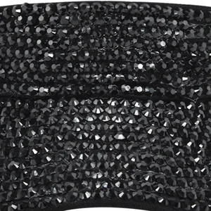 Close-up of baseball cap brim featuring dense black rhinestones and embroidery