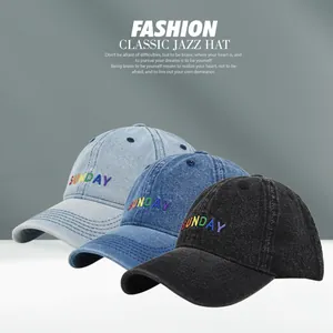 Detailed embroidery of SUNDAY text on denim baseball caps in light blue, dark blue and black