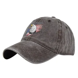 Close-up detail of vintage charcoal grey eagle embroidery on a washed cotton baseball cap