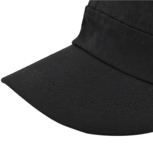 Detailed close-up of durable black cotton twill military cap with reinforced stitching