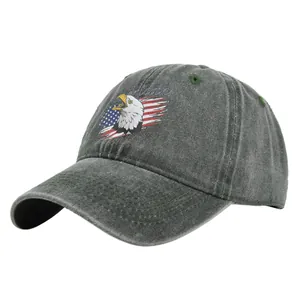 Close-up of vintage dark grey eagle embroidery on washed cotton mesh baseball cap