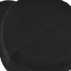 Detail of solid black military cap featuring premium twill fabric and durable stitching