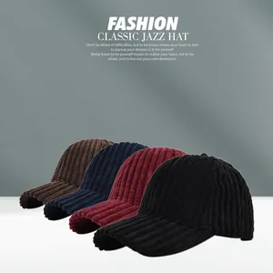 Detailed view of corduroy baseball caps in brown, navy, burgundy, and black colors