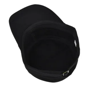 Close-up of a black cotton military cap showing internal washing label and metal buckle
