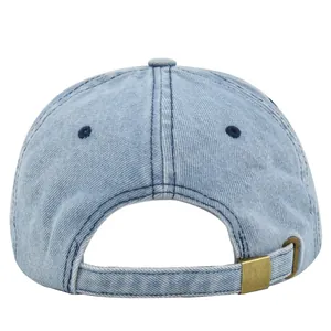 Detail view of denim baseball cap back with adjustable strap and vintage copper buckle