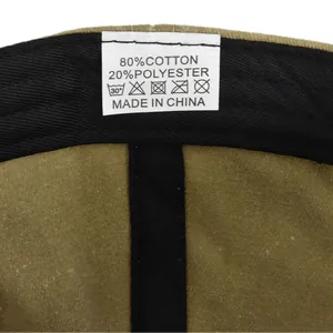 Close-up of baseball cap interior showing white fabric label with cotton blend specs