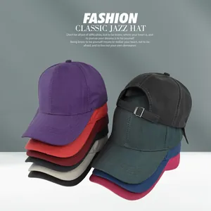 Detailed view of plain cotton baseball caps in multiple colors with metal buckles