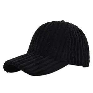 Detailed close-up of black corduroy baseball cap texture and premium fabric finish