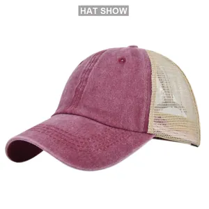 Macro detail of breathable cream mesh and burgundy washed cotton on the baseball cap