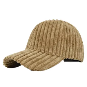 Close-up of the vertical striped corduroy texture on the khaki winter baseball cap