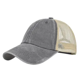 Close-up of vintage washed cotton texture and breathable mesh on gray trucker hat