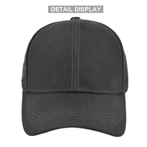 Detailed macro view of black baseball cap stitching and cotton fabric texture display