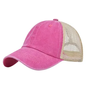 Detail of rose red washed fabric texture and beige breathable mesh on a trucker cap