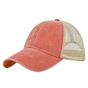 Detail of washed orange baseball cap featuring vintage distressed fabric and breathable mesh