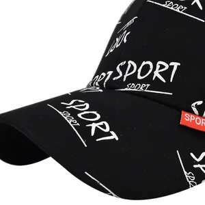 Detail of black baseball cap with white Sport print and red woven logo label