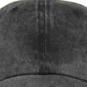 Close-up of washed black distressed cotton baseball cap showing detailed stitching and fabric