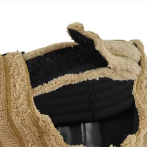 Close-up of sherpa fabric texture and adjustable black velcro closure on the baseball cap
