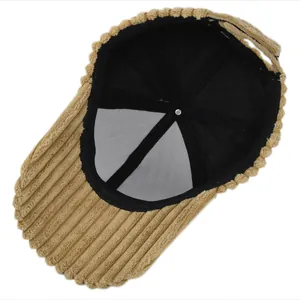 Detail view of khaki corduroy baseball cap interior with black lining and stitching