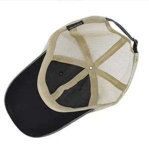 Detail view of the breathable mesh back and inner labels on a vintage baseball cap