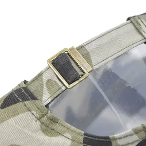 Detail of camouflage baseball cap with vintage bronze metal slider and adjustable strap