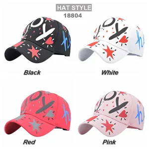 Graffiti baseball caps with JOY print in black, white, red, and pink colors