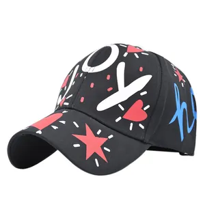 Black graffiti baseball cap with red star and white JOY print on a curved brim hat