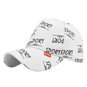 Detail of white baseball cap with black graffiti sport print and red side label logo