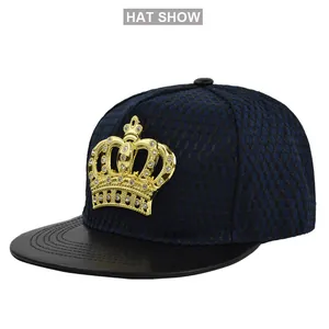 Detailed view of hip hop trucker hat with gold crown emblem and navy mesh crown