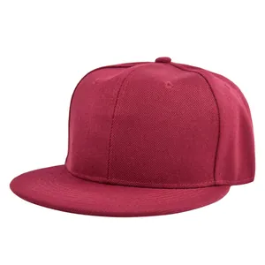 Front view of solid red flat brim snapback cap showing cotton twill texture and stitching