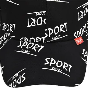 Detail of black baseball cap featuring full-print white SPORT letters and red woven label