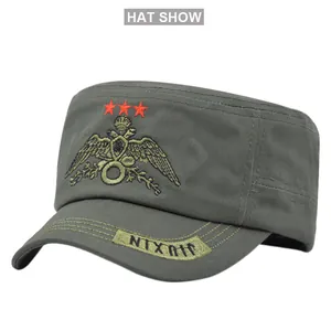 Detail of army green cadet cap with red stars and gold eagle crest embroidery