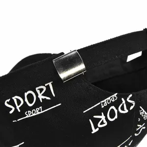 Detail of black baseball cap showing adjustable silver buckle and white SPORT graffiti print