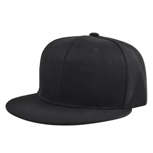 Detail view of the black cotton twill snapback cap featuring a classic six-panel structure