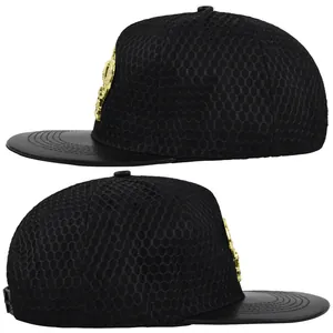 Detail view of black trucker hat with mesh fabric and textured leather brim panels