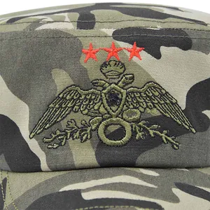 Front view of camouflage military cap featuring detailed eagle and star embroidery